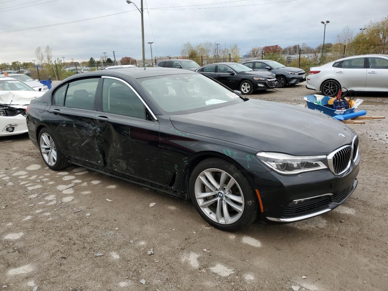 2018 BMW 7er VIN WBA7F2C52JG423636 Copart auction photo, side / minor dent/scratches damage thumbnail 4