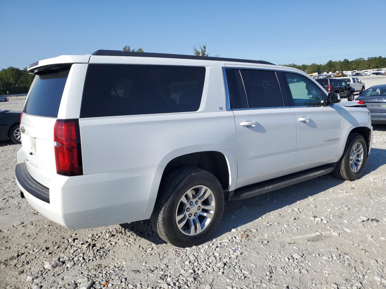 2015 Chevrolet Suburban VIN 1GNSCJKC2FR700918 Copart auction photo, front end / side damage thumbnail 3