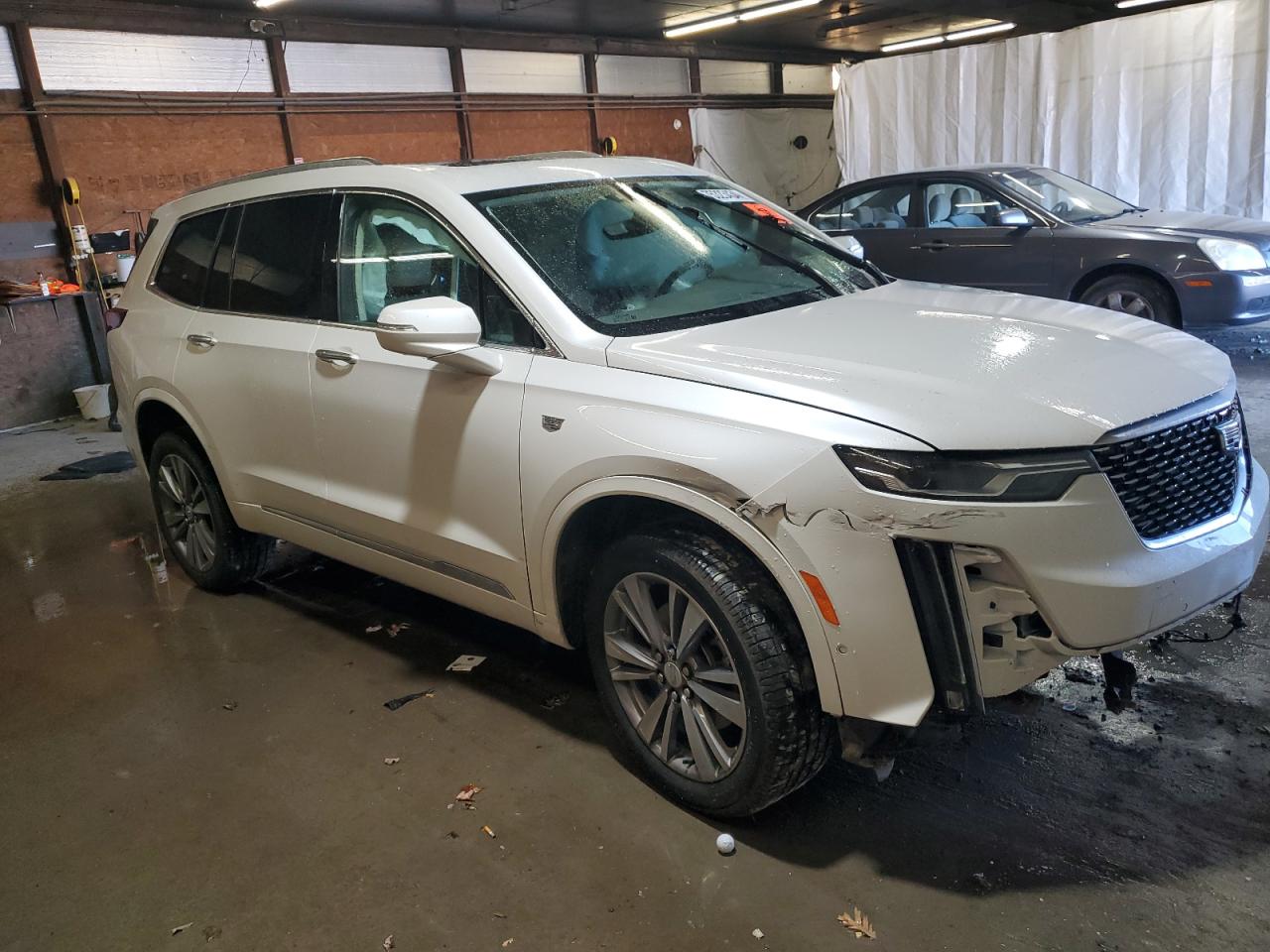 2022 Cadillac XT6 VIN 1GYKPDRS2NZ108715 Copart auction photo, side / front end damage thumbnail 4