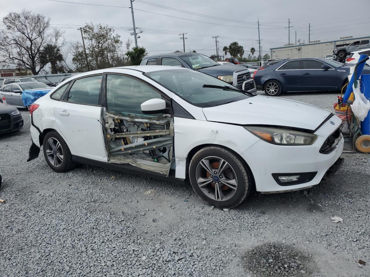 2018 Ford Focus VIN 1FADP3F29JL308300 Copart auction photo, water/flood / all over damage thumbnail 4