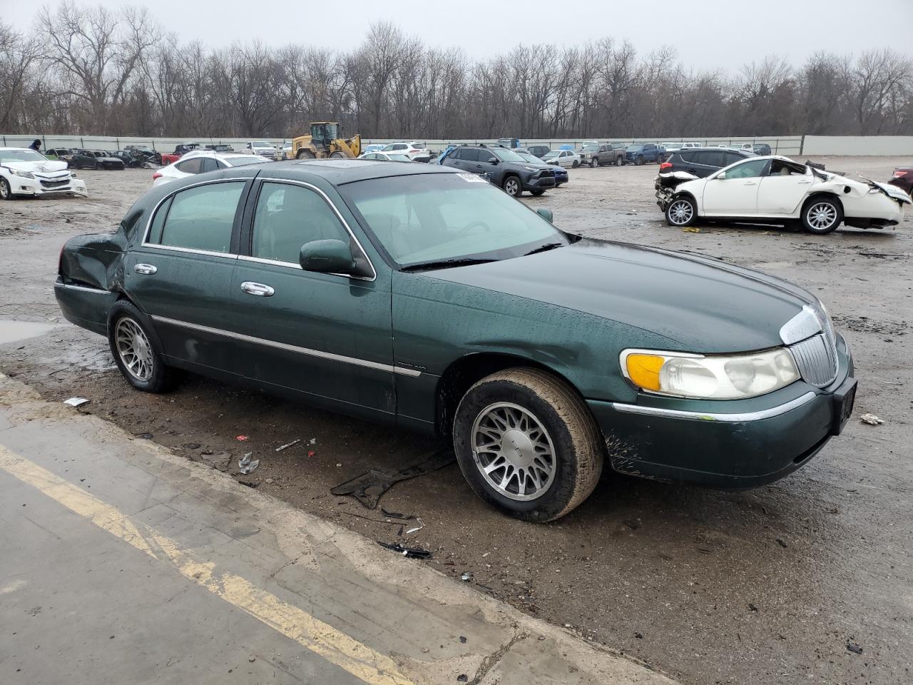 1999 Lincoln Town Car VIN 1LNHM82W7XY695169 Copart auction photo, rear end / minor dent/scratches damage thumbnail 4