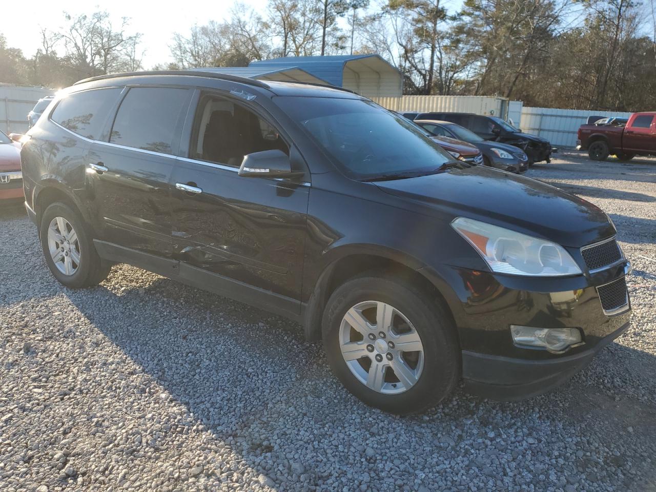 2011 Chevrolet Traverse VIN 1GNKRGED7BJ253260 Copart auction photo, side / front end damage thumbnail 4