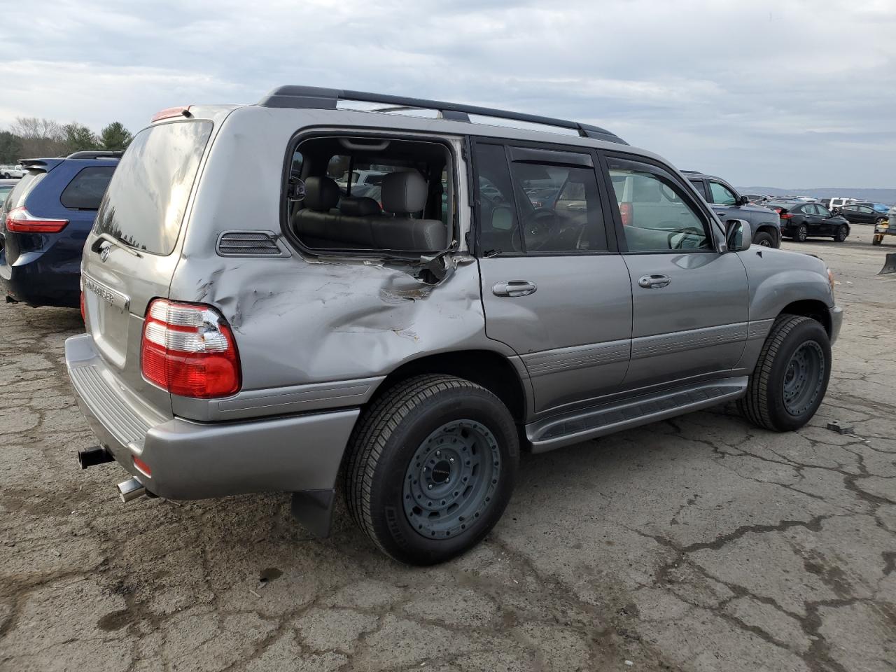 2004 Toyota Land Cruiser VIN JTEHT05J242065384 Copart auction photo, rear end damage thumbnail 3