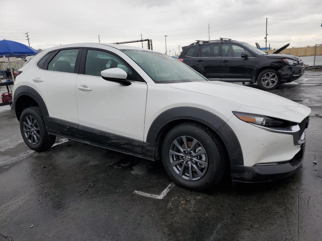 2023 Mazda CX-30 VIN 3MVDMBAM4PM522056 Copart auction photo, undercarriage / all over damage thumbnail 4