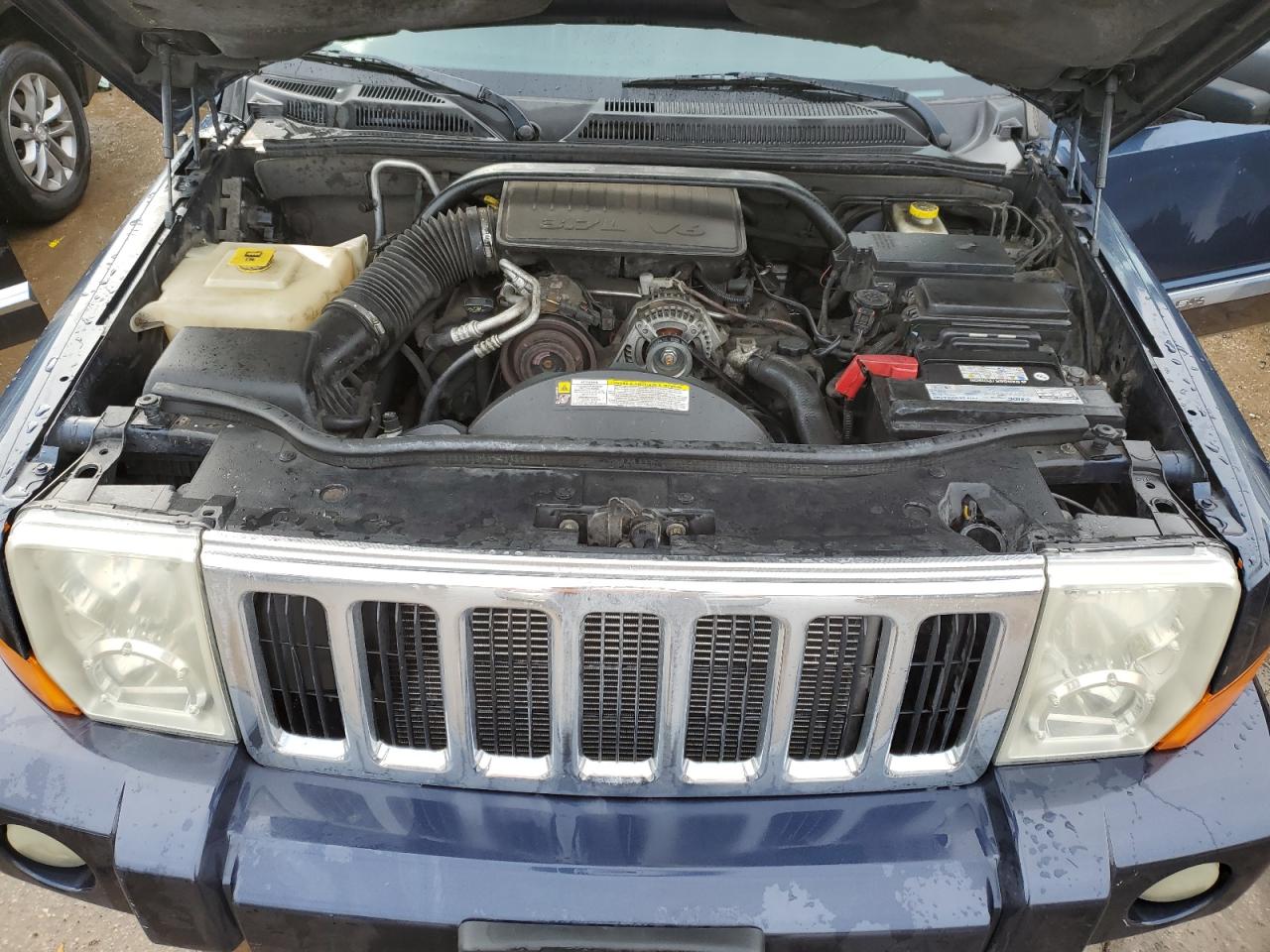 2010 Jeep Commander VIN 1J4RG4GK5AC119433 Copart auction photo, side / front end damage thumbnail 12