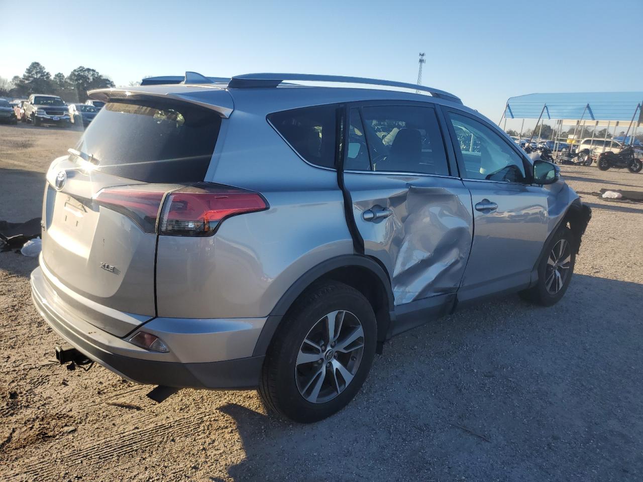 2018 Toyota RAV 4 VIN 2T3WFREV9JW446131 Copart auction photo, front end / side damage thumbnail 3