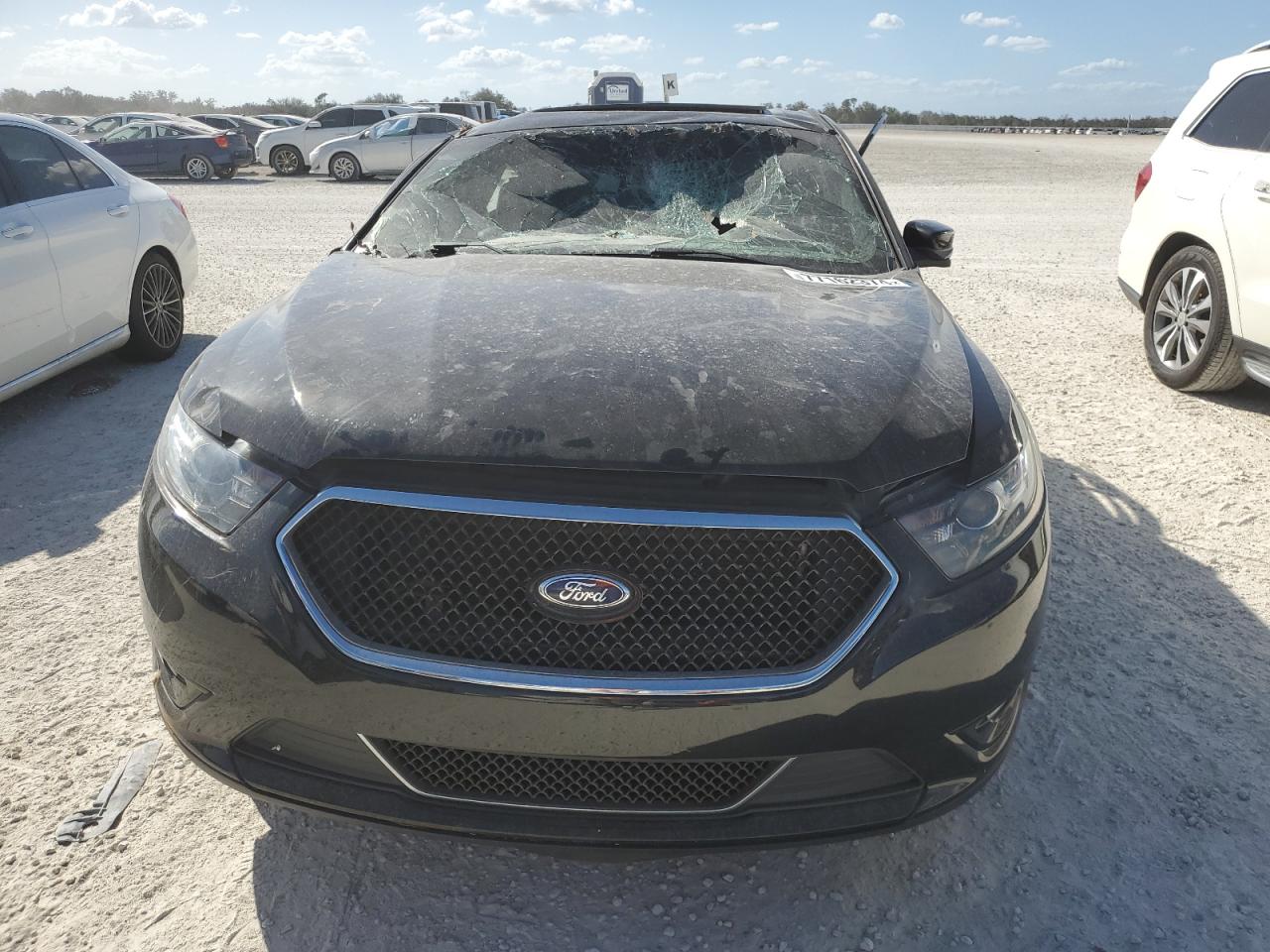 2014 Ford Taurus VIN 1FAHP2KT4EG160775 Copart auction photo, water/flood damage thumbnail 5