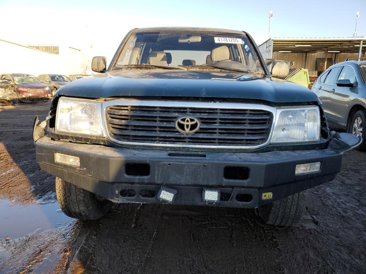 1998 Toyota Land Cruiser VIN JT3HT05J0W0015414 Copart auction photo, side / front end damage thumbnail 5