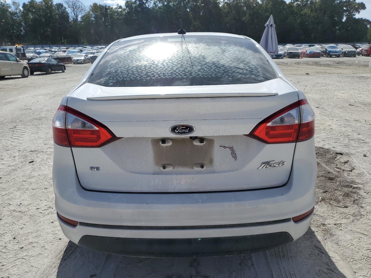 2019 Ford Fiesta VIN 3FADP4BJXKM123563 Copart auction photo, side / rear end damage thumbnail 6