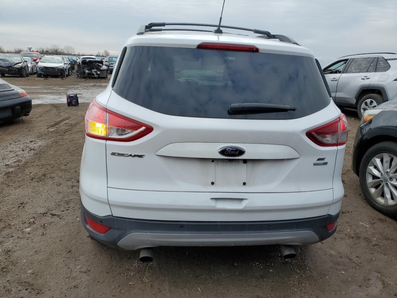 2014 Ford Escape VIN 1FMCU9GX0EUD51785 Copart auction photo, side / minor dent/scratches damage thumbnail 6