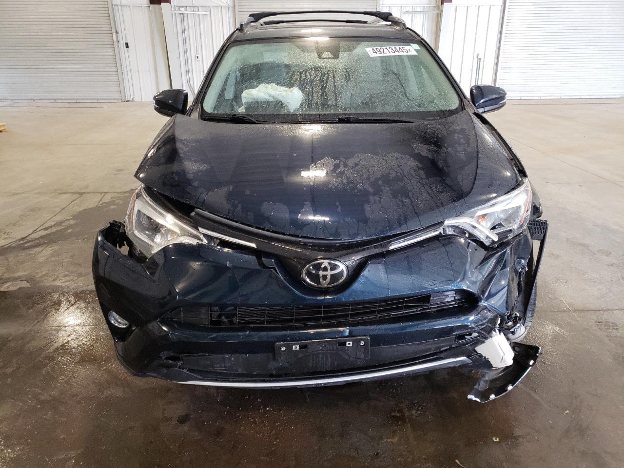 2018 Toyota RAV 4 VIN JTMDFREV3JJ200567 Copart auction photo, front end / side damage thumbnail 5