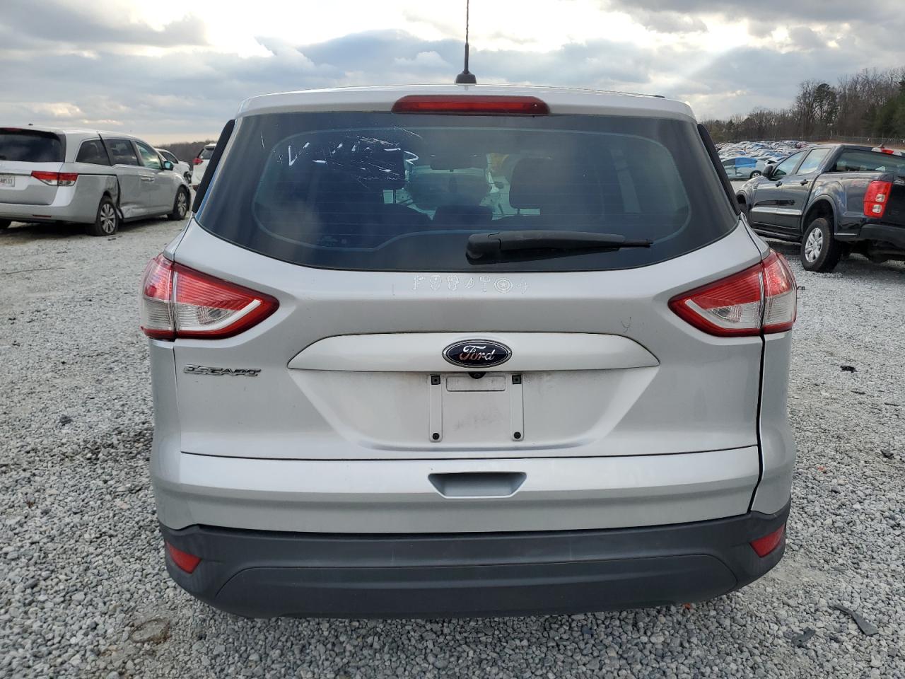 2016 Ford Escape VIN 1FMCU0F7XGUC34053 Copart auction photo, all over damage thumbnail 6