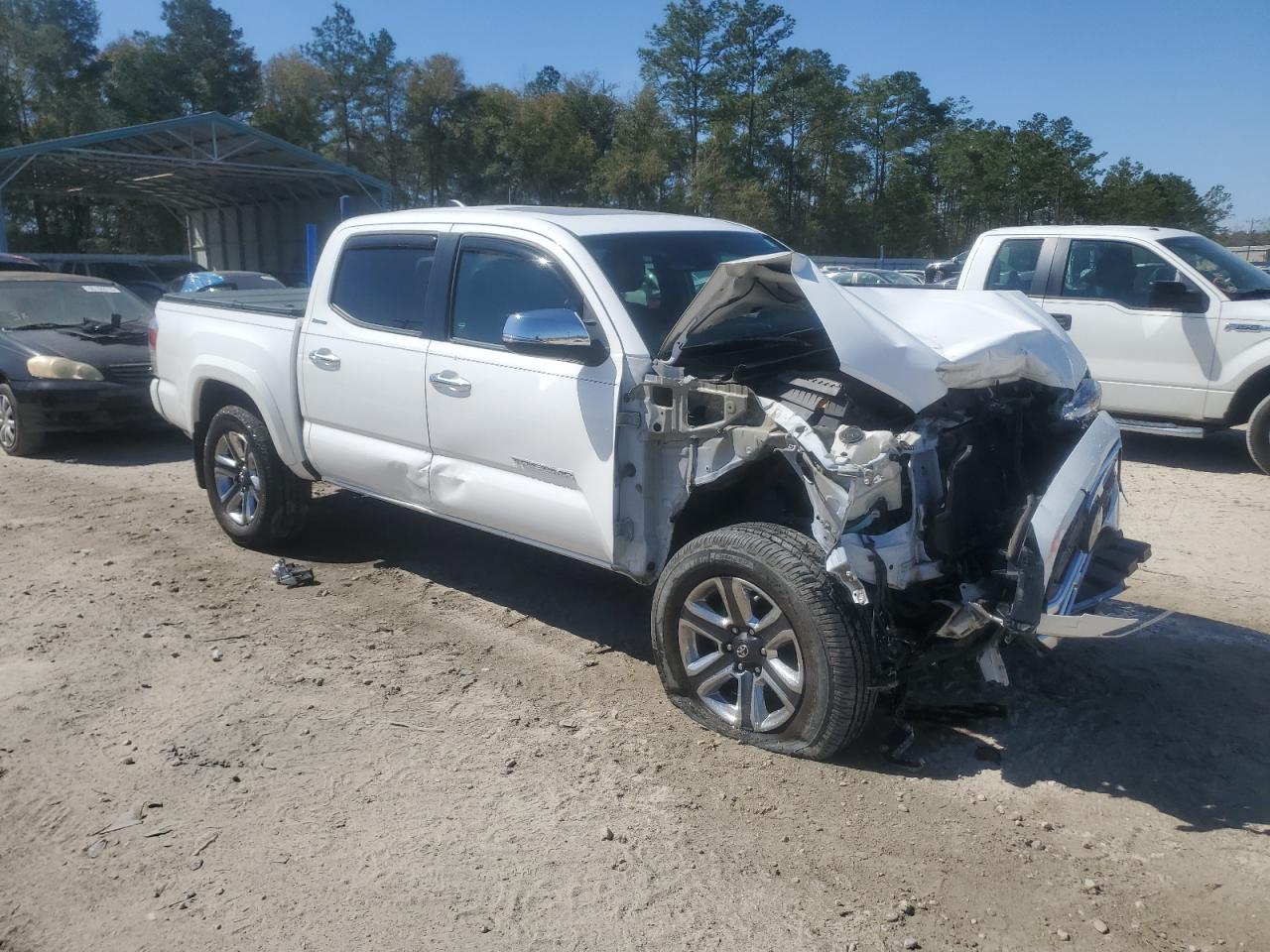 2018 Toyota Tacoma VIN 3TMGZ5AN6JM127989 Copart auction photo, front end / side damage thumbnail 4