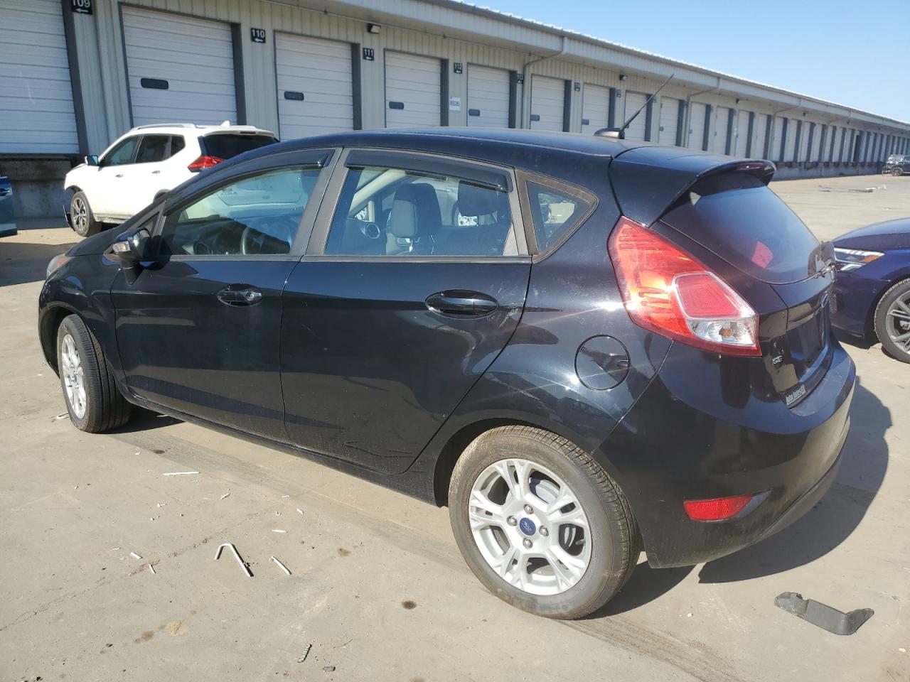 2016 Ford Fiesta VIN 3FADP4EJ7GM142848 Copart auction photo, vandalism damage thumbnail 2