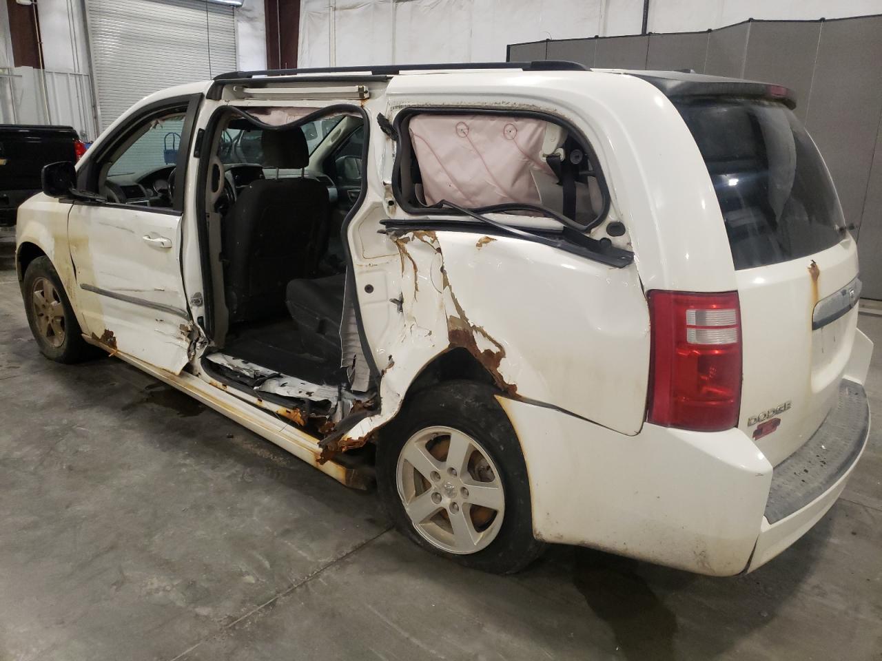 2010 Dodge Caravan VIN 2D4RN5D1XAR210544 Copart auction photo, side / front end damage thumbnail 2