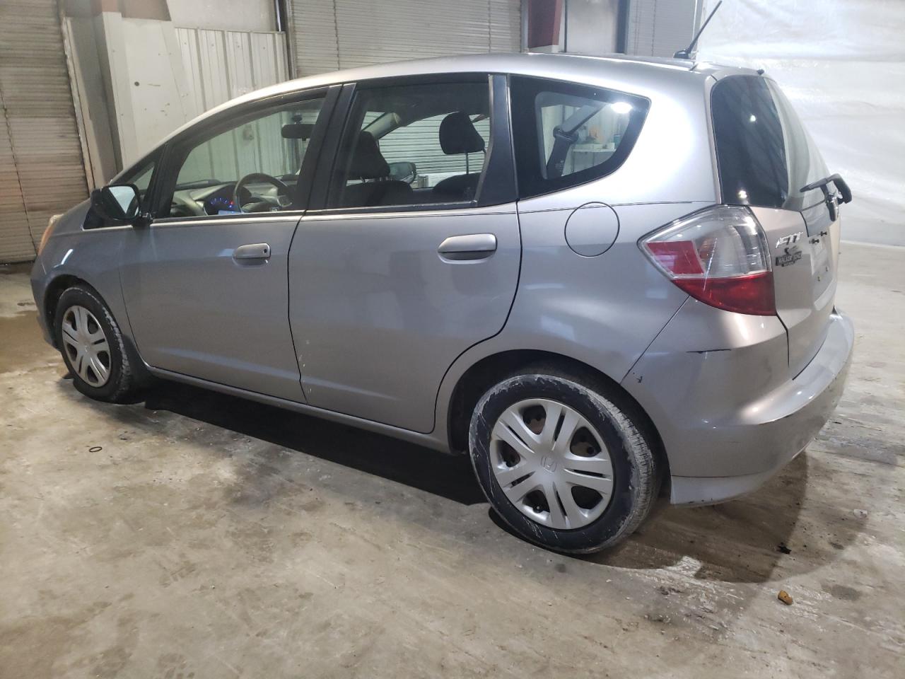 2010 Honda Fit VIN JHMGE8H23AS012880 Copart auction photo, side damage thumbnail 2