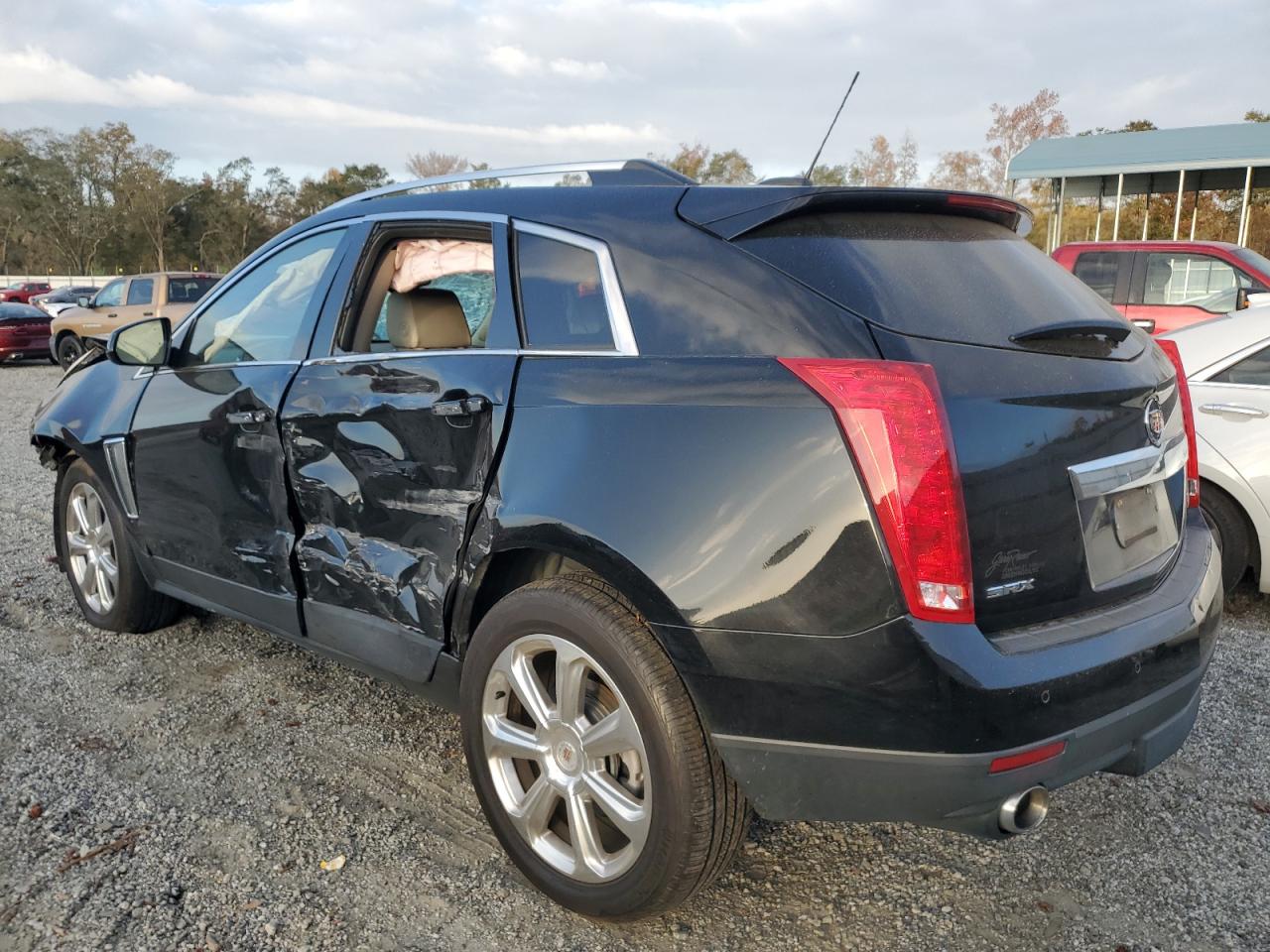 2015 Cadillac SRX VIN 3GYFNDE36FS579903 Copart auction photo, side / minor dent/scratches damage thumbnail 2