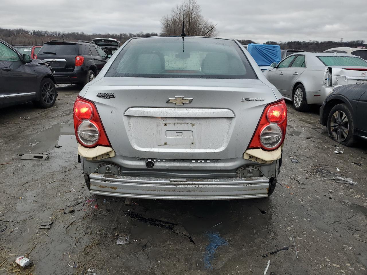 2012 Chevrolet Sonic VIN 1G1JA5SHXC4195211 Copart auction photo, side / rear end damage thumbnail 6