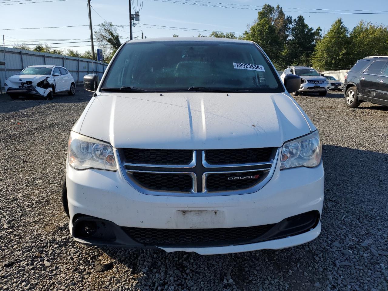 2016 Dodge Caravan VIN 2C4RDGBG5GR117362 Copart auction photo, water/flood damage thumbnail 5