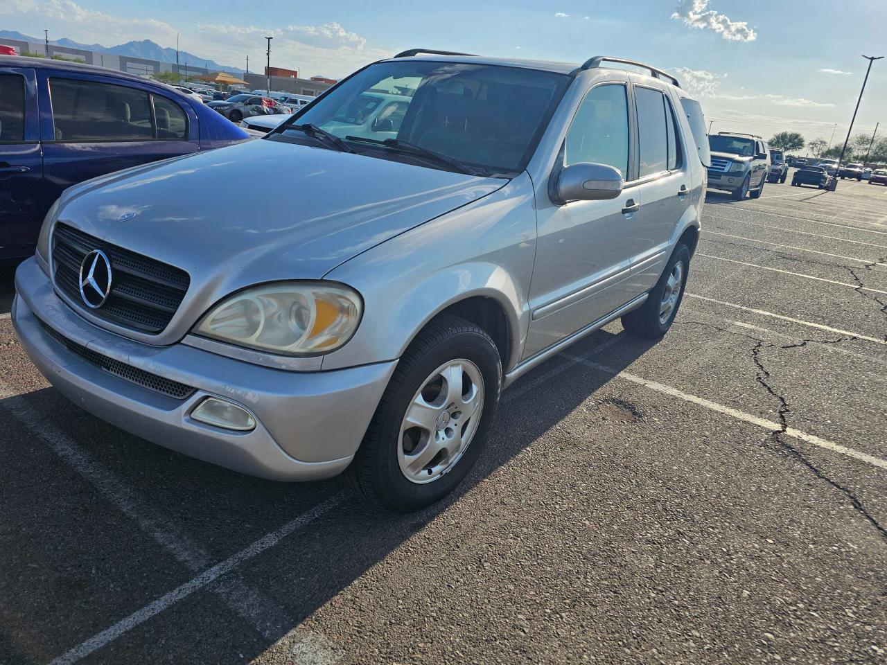 2002 Mercedes-Benz M-klasse VIN 4JGAB54EX2A347717 Copart auction photo, minor dent/scratches / normal wear damage thumbnail 2
