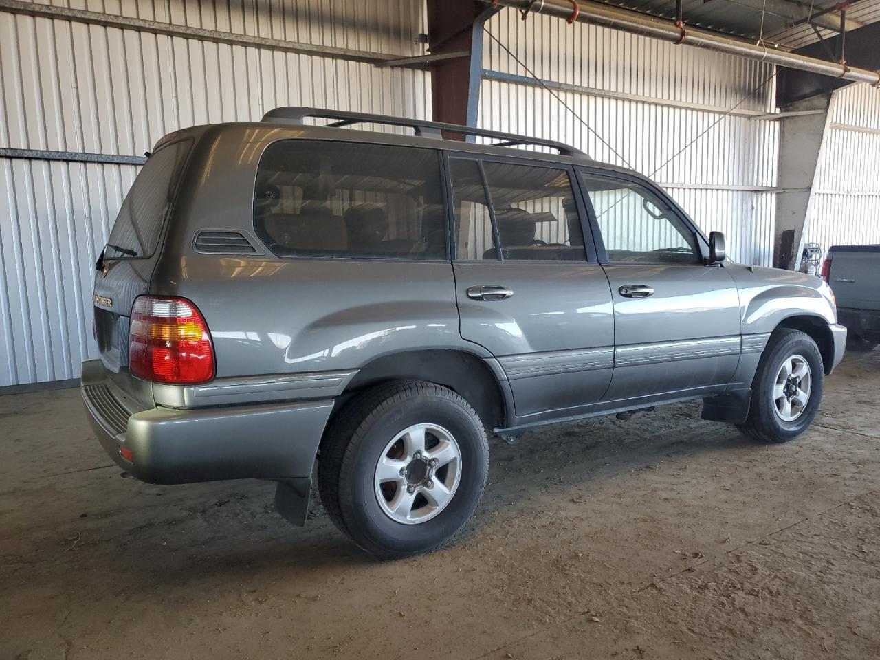 1998 Toyota Land Cruiser VIN JT3HT05J4W0011057 Copart auction photo, side damage thumbnail 3