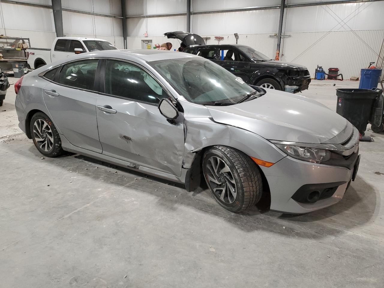 2018 Honda Civic VIN 19XFC2F8XJE009856 Copart auction photo, side / front end damage thumbnail 4