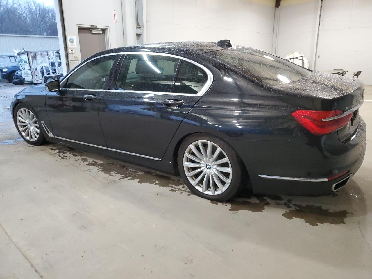 2017 BMW 7er VIN WBA7E4C53HGU99097 Copart auction photo, undercarriage / minor dent/scratches damage thumbnail 2