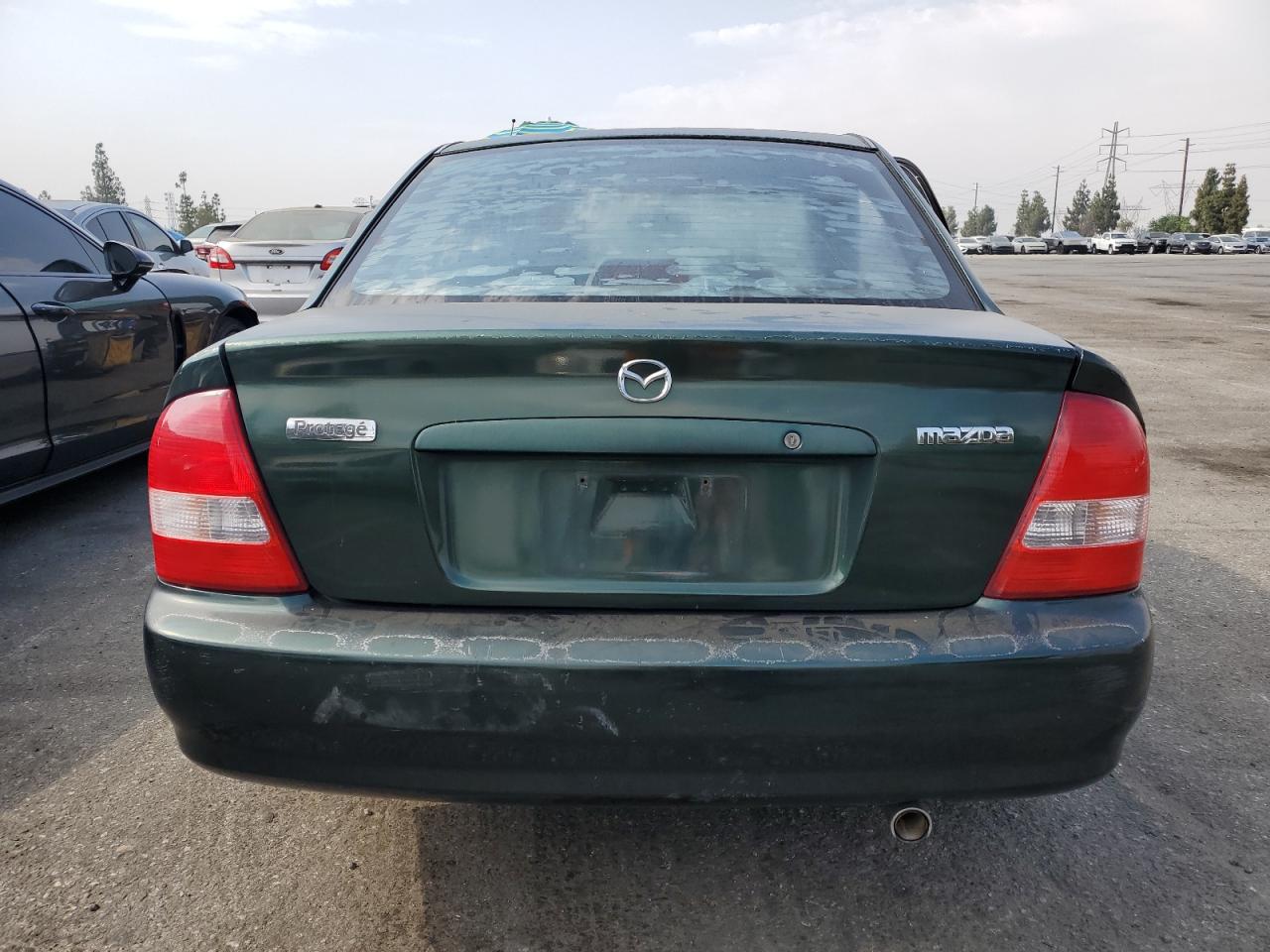 2000 Mazda Protege VIN JM1BJ2221Y0238418 Copart auction photo, side damage thumbnail 6