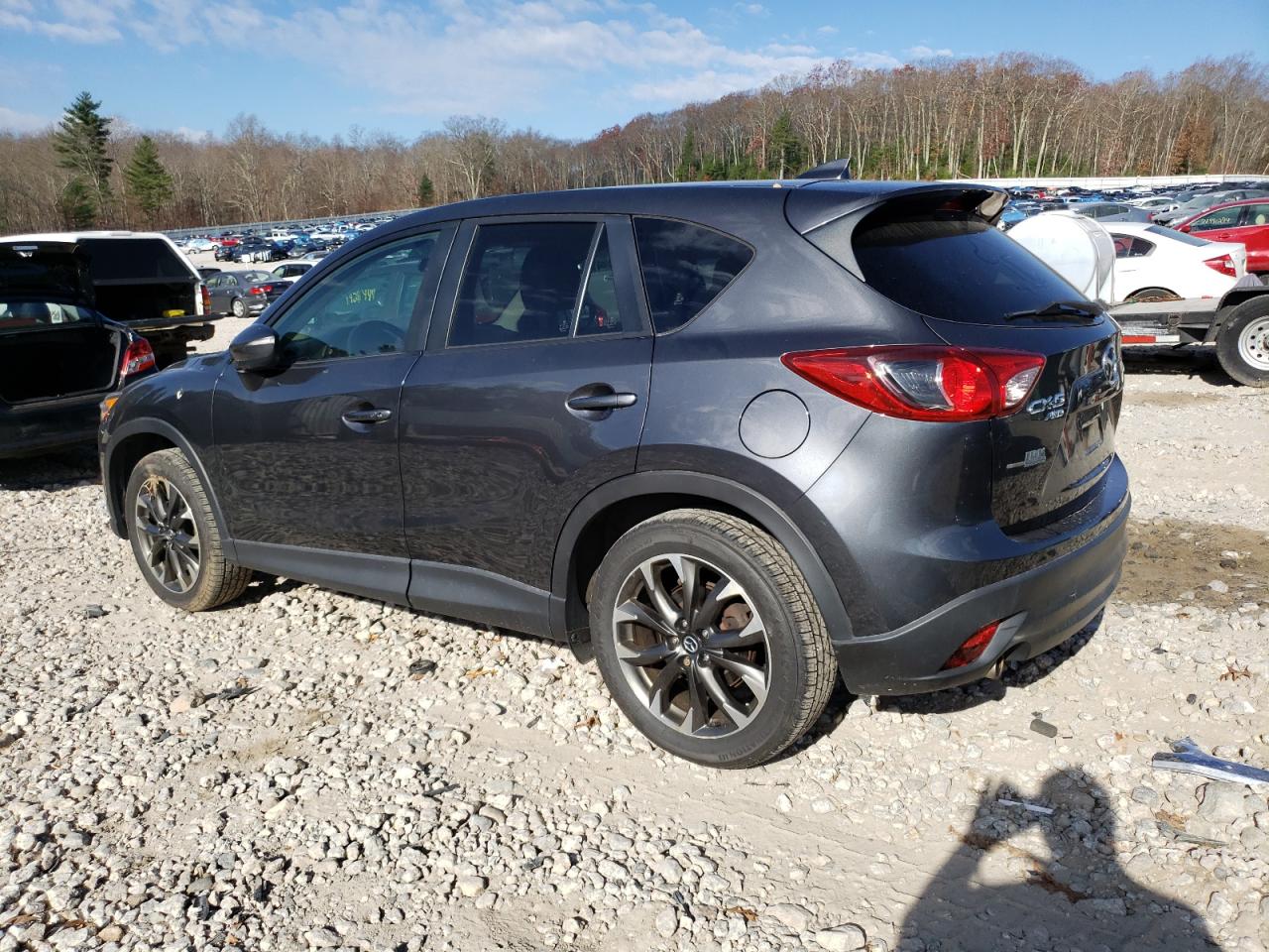 2016 Mazda CX-5 VIN JM3KE4DY0G0879101 Copart auction photo, side / minor dent/scratches damage thumbnail 2