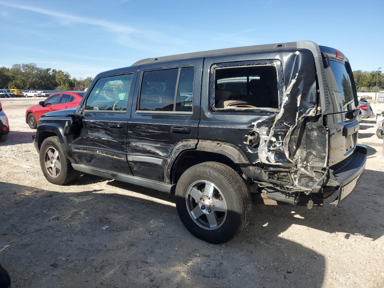 2009 Jeep Commander VIN 1J8HH48KX9C519330 Copart auction photo, side / rear end damage thumbnail 2