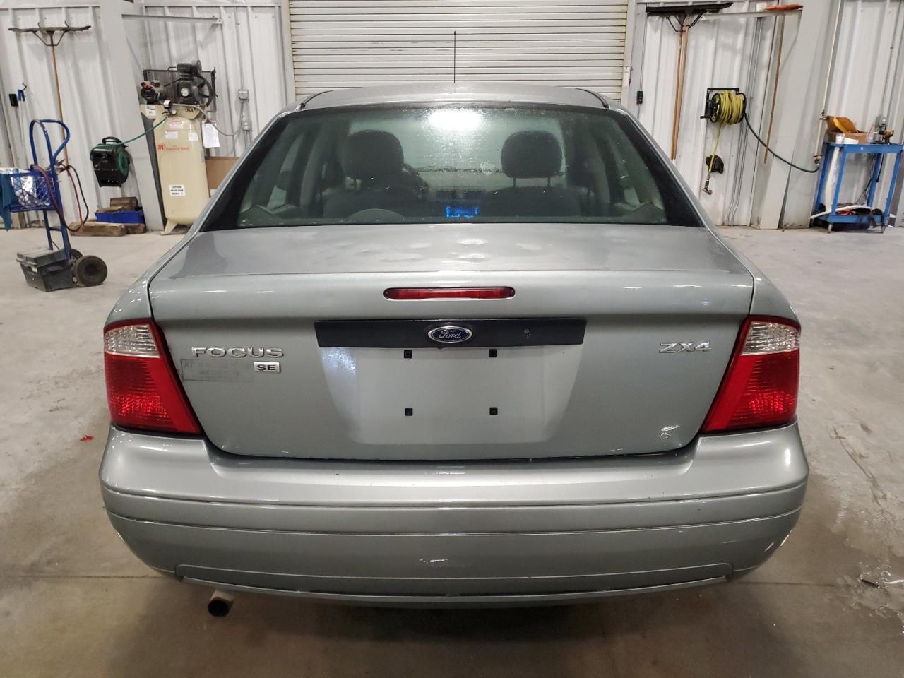 2006 Ford Focus VIN 1FAFP34N36W234688 Copart auction photo, hail damage thumbnail 6