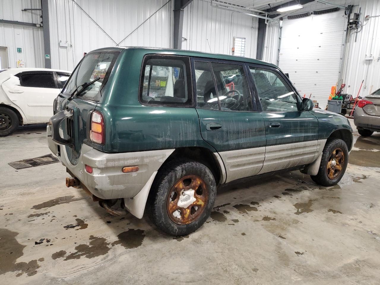 1999 Toyota RAV 4 VIN JT3HP10V7X0207709 Copart auction photo, undercarriage / minor dent/scratches damage thumbnail 3