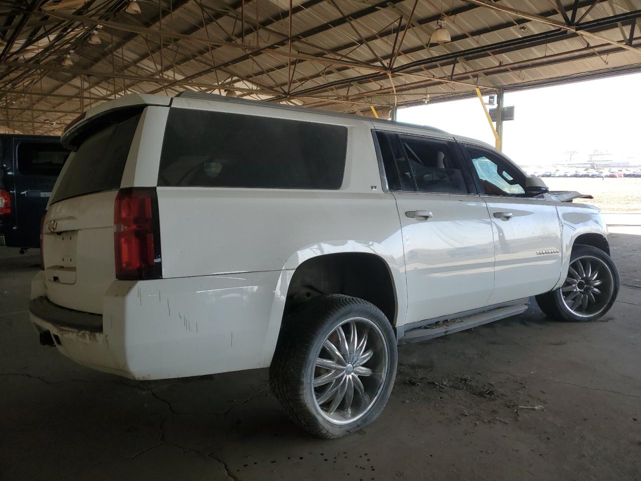 2015 Chevrolet Suburban VIN 1GNSCJKC3FR585391 Copart auction photo, all over damage thumbnail 3