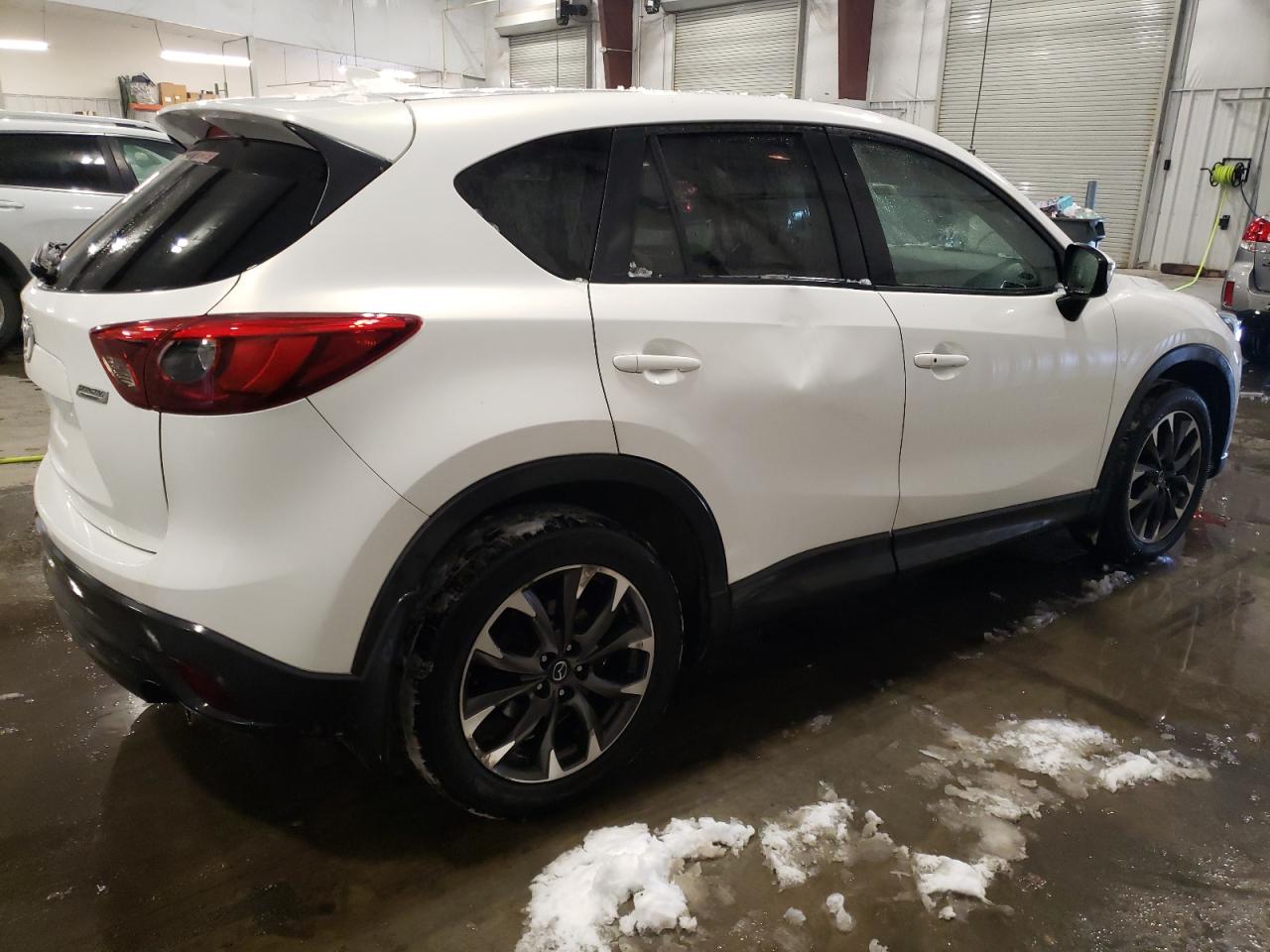 2016 Mazda CX-5 VIN JM3KE4DYXG0732414 Copart auction photo, side / front end damage thumbnail 3