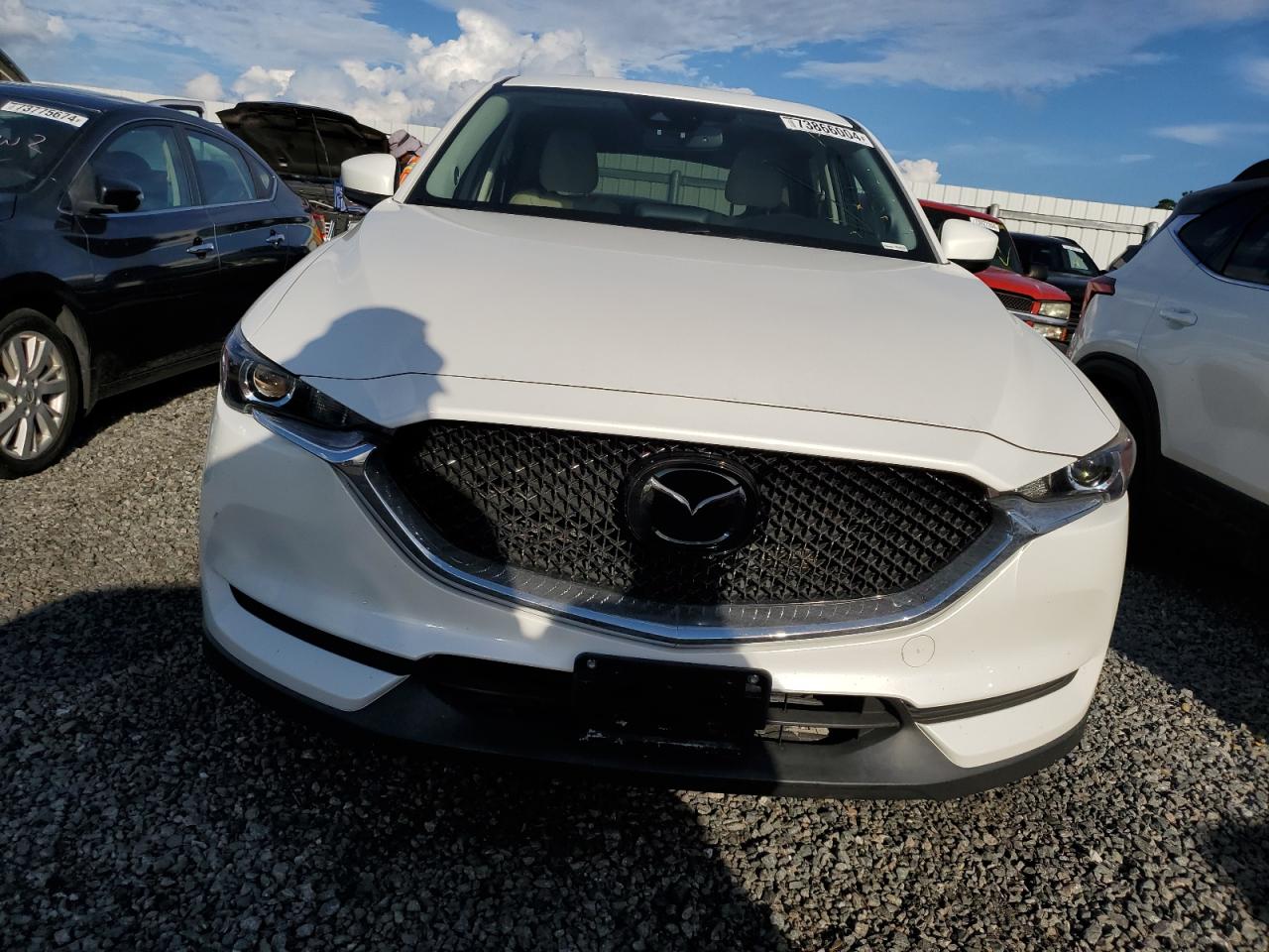 2018 Mazda CX-5 VIN JM3KFACM6J0336448 Copart auction photo, water/flood damage thumbnail 5