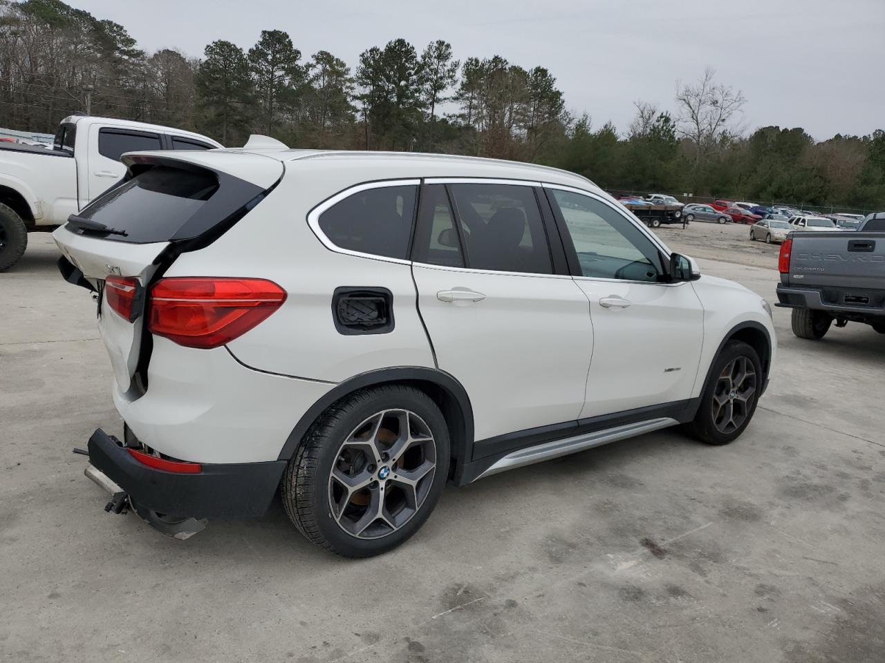 2016 BMW X1 VIN WBXHT3C31G5E50647 Copart auction photo, rear end / front end damage thumbnail 3