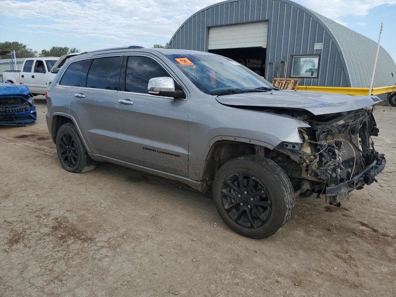 2015 Jeep Grand Cherokee VIN 1C4RJFBG5FC865605 Copart auction photo, front end / top/roof damage thumbnail 4