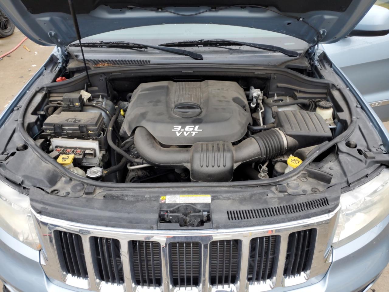 2012 Jeep Grand Cherokee VIN 1C4RJFAG1CC233987 Copart auction photo, front end / side damage thumbnail 11