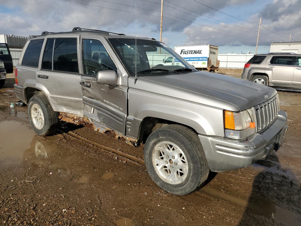 1997 Jeep Grand Cherokee VIN 1J4GZ78Y0VC556381 Copart auction photo, side / undercarriage damage thumbnail 4