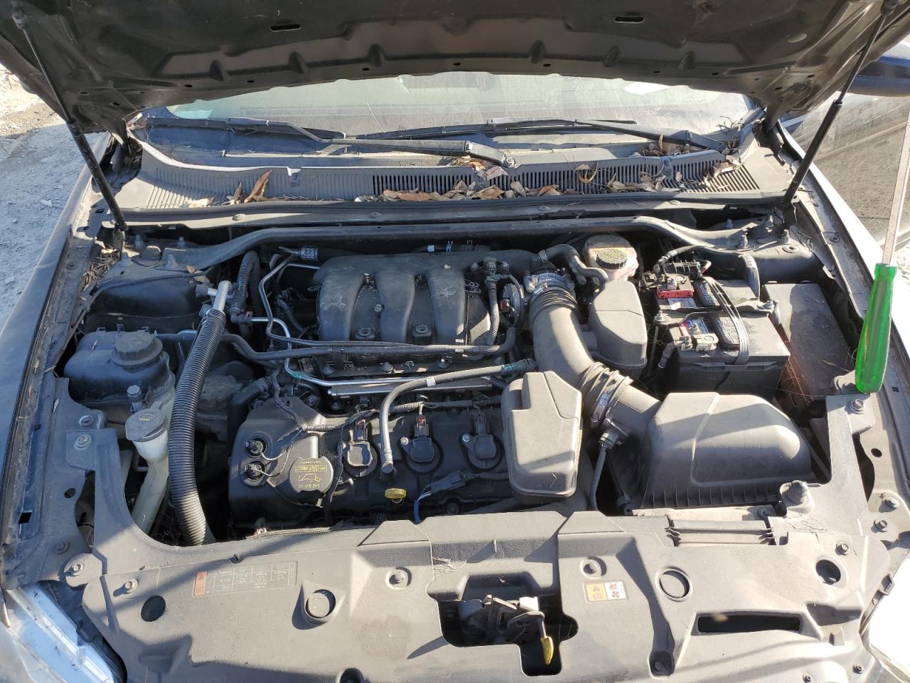 2013 Ford Taurus VIN 1FAHP2E81DG117338 Copart auction photo, side / front end damage thumbnail 11