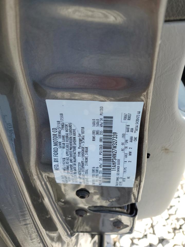 2007 Ford Focus VIN 1FAHP34N27W327339 Copart auction photo, all over damage thumbnail 12