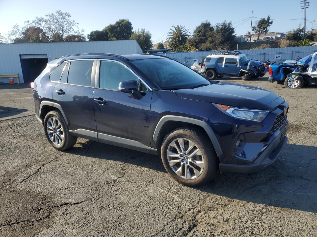 2019 Toyota RAV 4 VIN 2T3C1RFV7KC001096 Copart auction photo, side / front end damage thumbnail 4