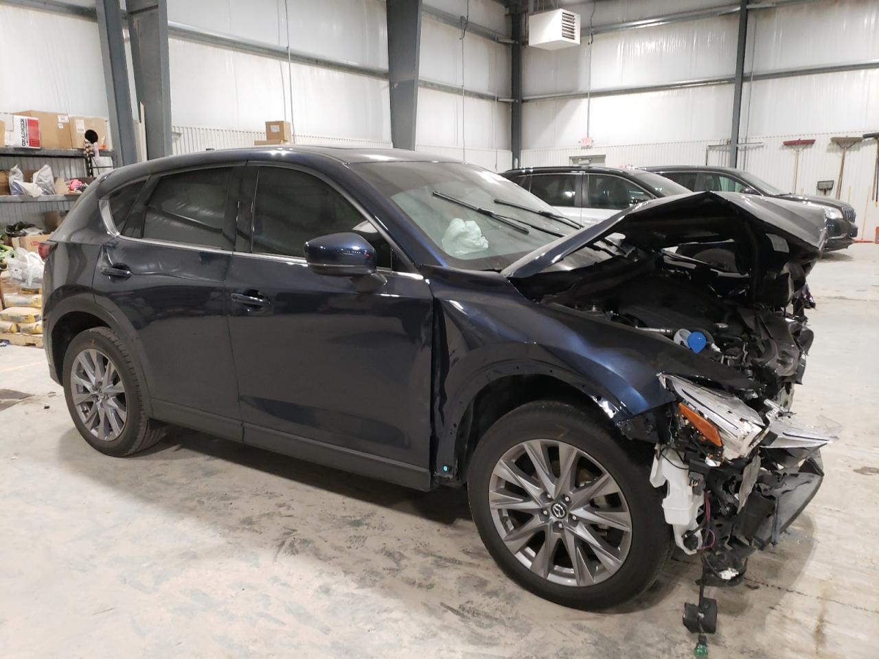 2021 Mazda CX-5 VIN JM3KFBDM2M1380353 Copart auction photo, front end / side damage thumbnail 4
