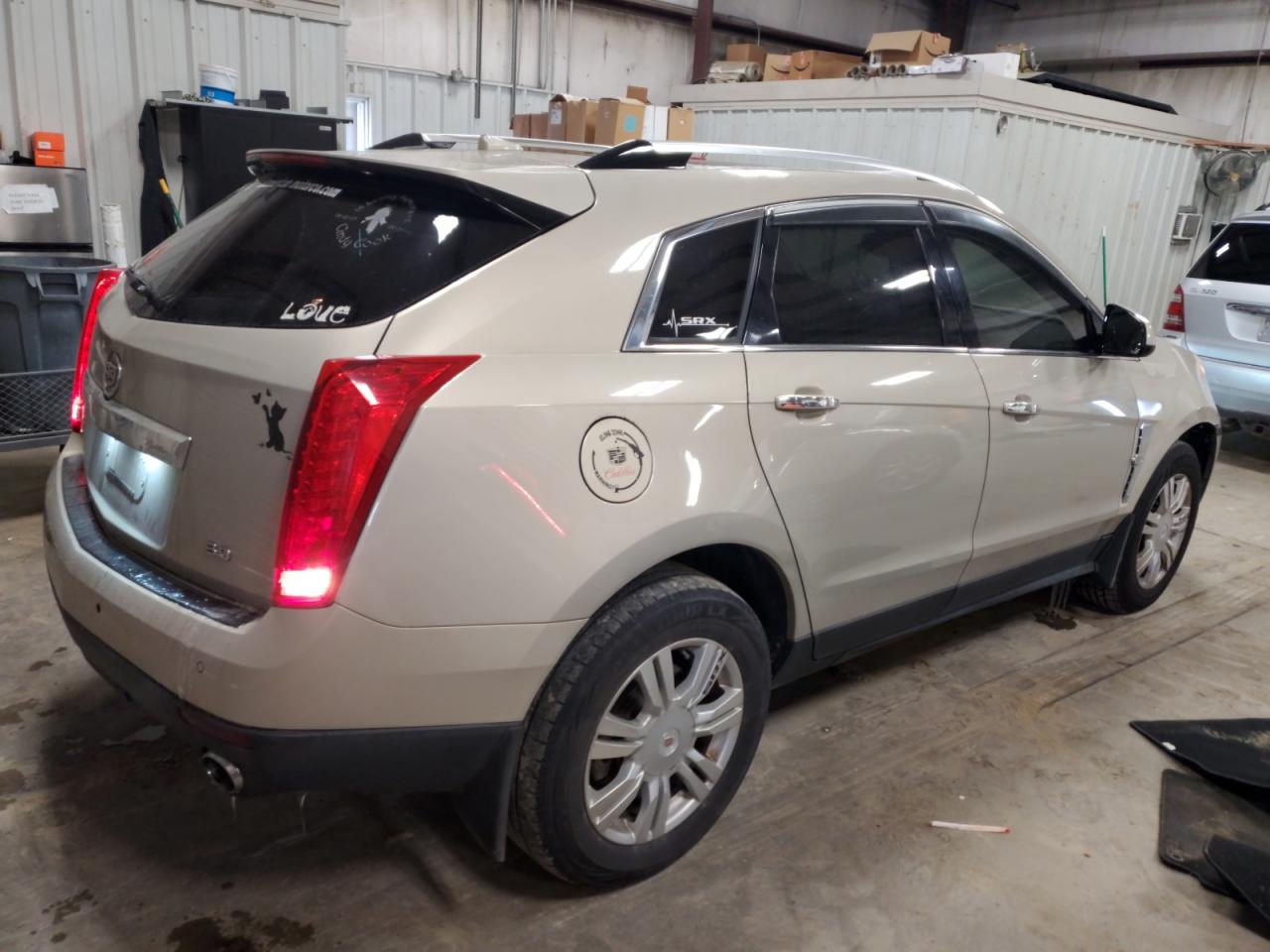 2010 Cadillac SRX VIN 3GYFNAEYXAS566655 Copart auction photo, front end / minor dent/scratches damage thumbnail 3