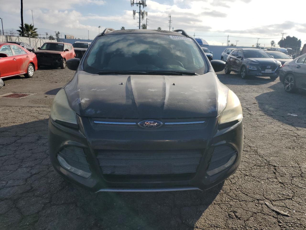 2015 Ford Escape VIN 1FMCU0GX4FUA18843 Copart auction photo, side / minor dent/scratches damage thumbnail 5