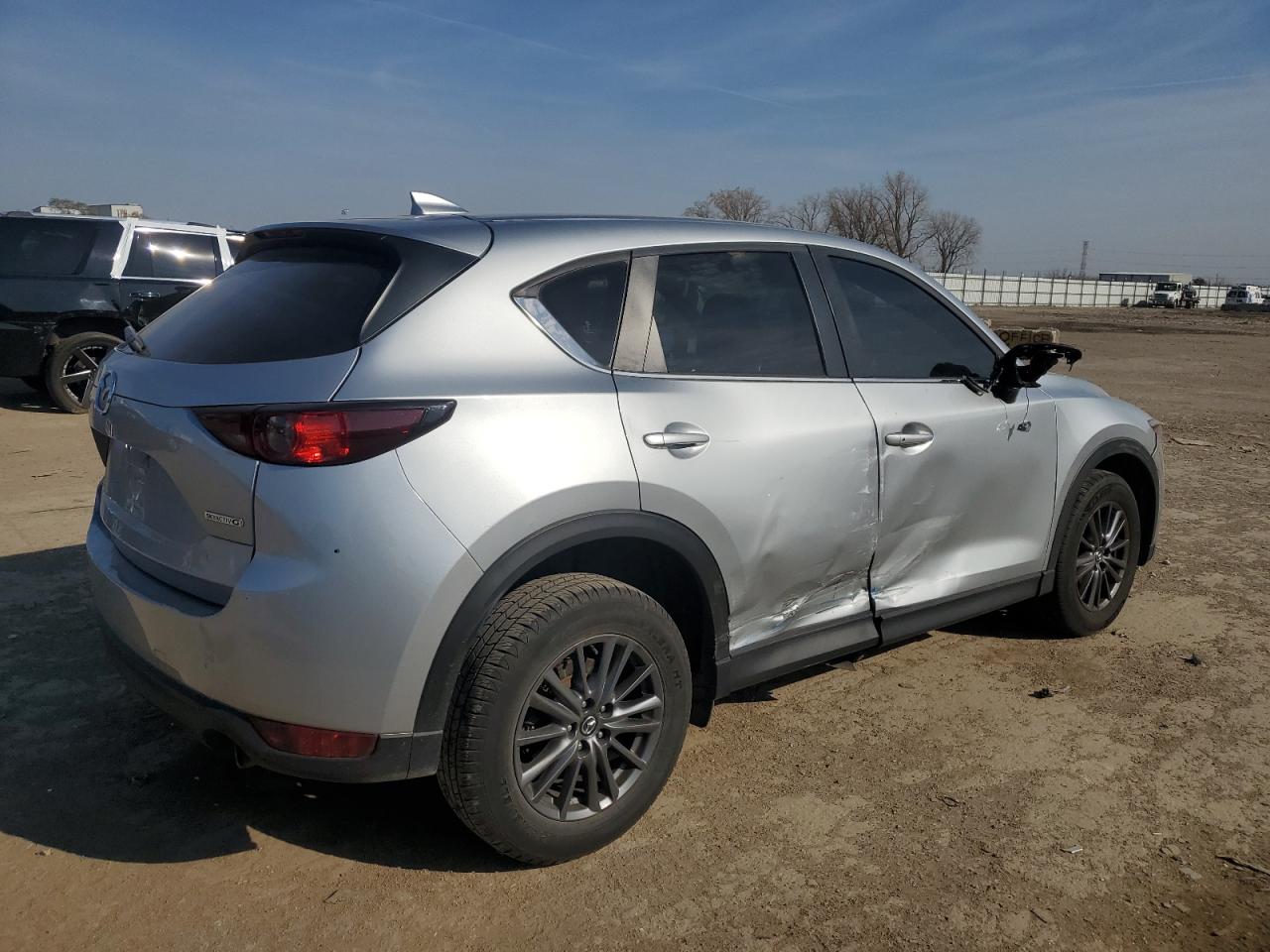 2021 Mazda CX-5 VIN JM3KFBCM7M0339840 Copart auction photo, side / rear end damage thumbnail 3