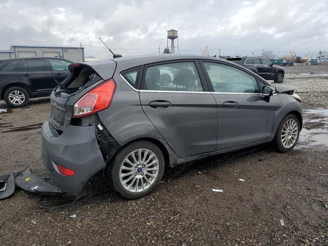 2015 Ford Fiesta VIN 3FADP4FJXFM179227 Copart auction photo, front end / rear end damage thumbnail 3