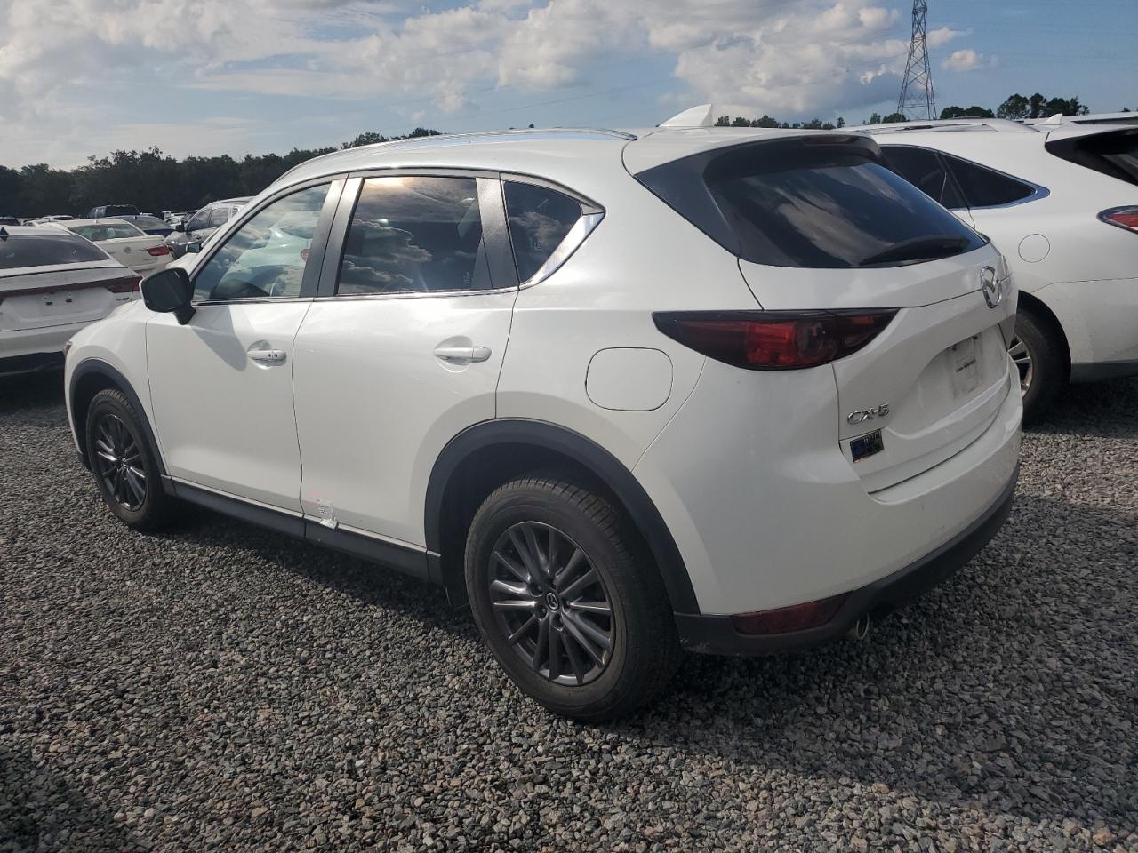 2021 Mazda CX-5 VIN JM3KFACM9M0304873 Copart auction photo, water/flood damage thumbnail 2