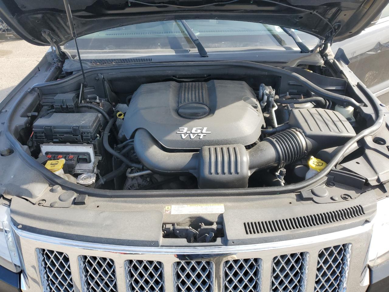 2013 Jeep Grand Cherokee VIN 1C4RJFAG7DC561173 Copart auction photo, front end / minor dent/scratches damage thumbnail 12