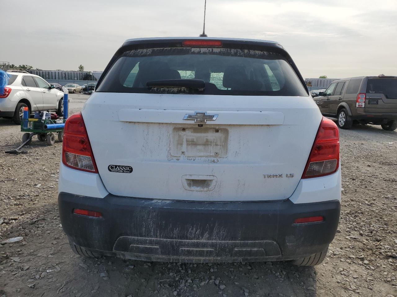 2015 Chevrolet Trax VIN 3GNCJKSB1FL256736 Copart auction photo, side damage thumbnail 6
